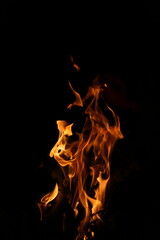 Fire flames on black background. Closeup of fire flames isolated on black background