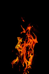 Fire flames on black background. Closeup of fire flames isolated on black background