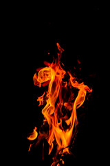 Fire flames on black background. Closeup of fire flames isolated on black background