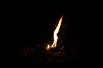 Fire flames on black background. Closeup of fire flames isolated on black background