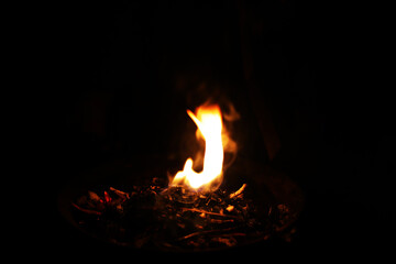 Fire flames on black background. Closeup of fire flames isolated on black background
