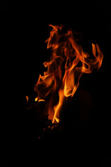 Fire flames on black background. Closeup of fire flames isolated on black background
