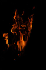 Fire flames on black background. Closeup of fire flames isolated on black background