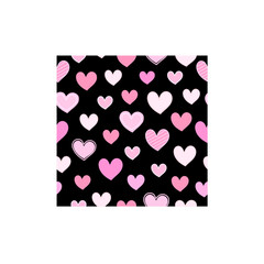 Pink heart pattern on black background. Seamless pattern for graphic design, fabric, or paper.