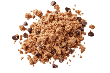 Flying pile of chocolate chip cookie crumbs scattered across a white surface during a home baking session in the afternoon light
