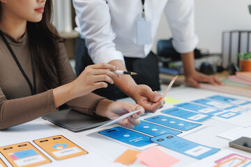 Ux designers working on wireframes for mobile application development