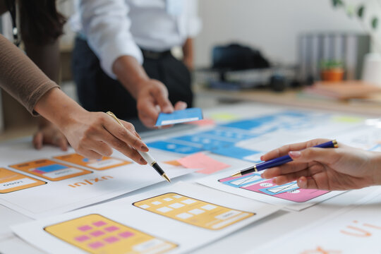 Ux designers working on wireframes for mobile application development