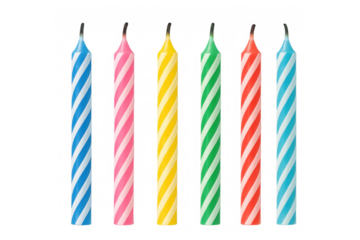 Colorful striped birthday candles burning out, scattered on transparent surface, suitable for festive celebration designs and greeting card elements