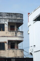 an old building with peeling paint and mold that is starting to turn black.