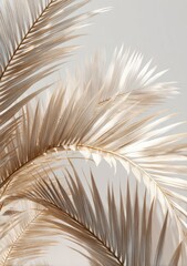 Pale beige palm fronds against a muted gray backdrop, showcasing delicate textures and soft lighting