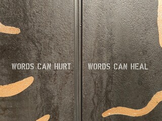 Wall with text  written Words can hurt , Words can heal -  words are powerful enough to lead to...