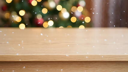 Wooden tabletop with falling snow and blurred christmas tree lights background