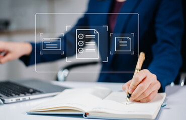 woman hand writing in notebook with digital checklist graphics overlay. Concept of productivity, workflow planning