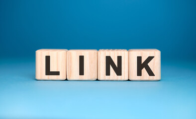 LINK - text concept on wooden cubes with gradient blue background