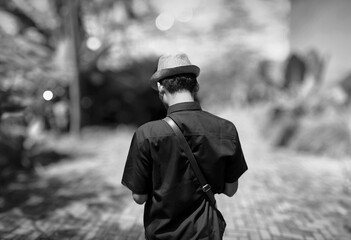 Man in hat seen from behind
