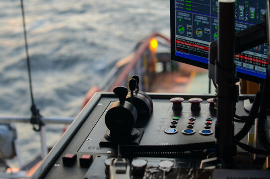 The Dynamic Positioning control panel of the offshore support vessel. Bow Thruster and Azimuth Driver levers are on neutral positions as the vessel is in Dynamic Positioning mode and maintain position