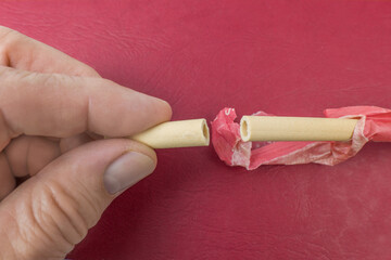 Edible straw on a red background
