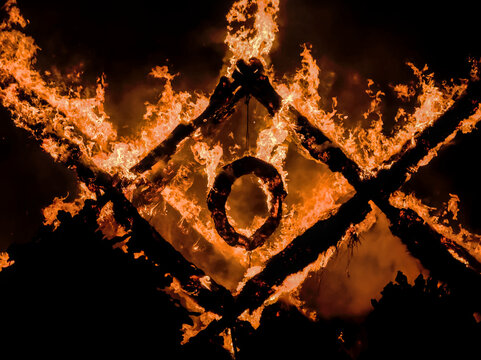 Burning structure shaped as latvian traditional austras tree ornament at Midsummer celebration