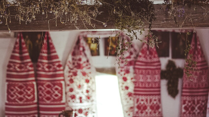 Interior of traditional Ukrainian house with embroidered rushnyky on walls