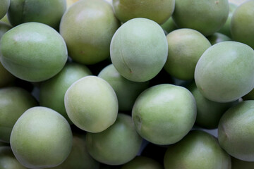 Full frame macro shot of green plum. Fruit background.