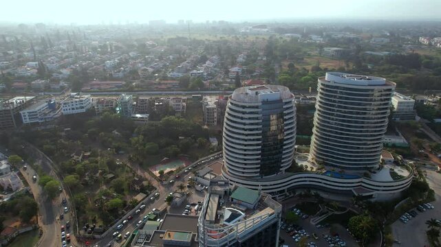 Sweeping aerial pullback from Maputo&rsquo;s Twin Towers reveals the Somershield coast and city skyline of Mozambique