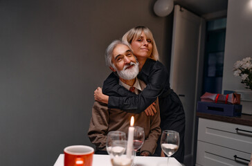 A heartwarming scene of a father and daughter embracing warmly, enjoying quality time at home.