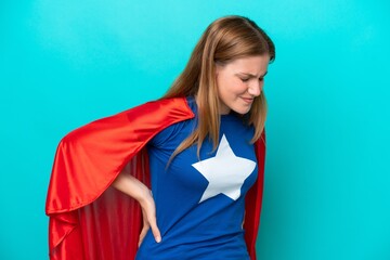 Super Hero caucasian woman isolated on blue background suffering from backache for having made an...