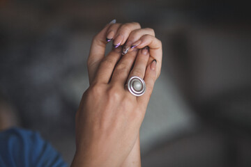 Elegant Female Hands with Ring Gracefully Folded
