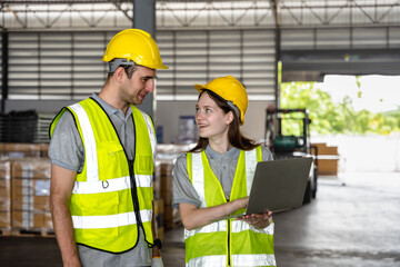 Caucasian male and female warehouse worker teammates working in distribution warehouse factory 