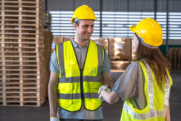 Caucasian male and female warehouse worker teammates working in distribution warehouse factory 
