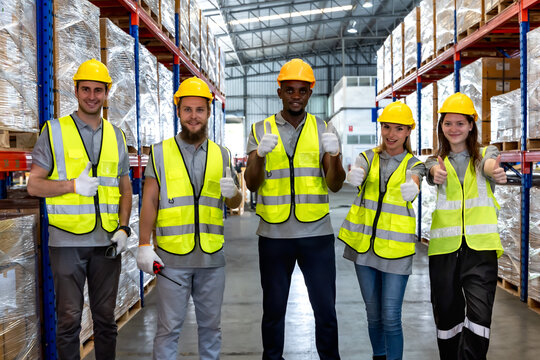 Photo group of diversity warehouse workers  working together in manufacturing factory warehouse 