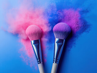 Two makeup brushes with vibrant pink and purple powder create dynamic and colorful display on blue background, showcasing beauty and creativity