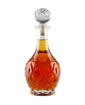 Elegant crystal decanter filled with amber liquid featuring decorative facets and a matching stopper on transparent background.