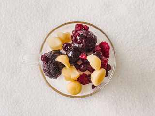 Top view of yogurt dessert with assorted fresh berries