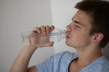 Young Man Drinking Water in Bed. _Morning Thoughts Collection
