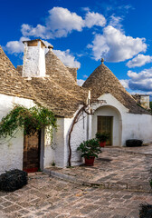old mediterranean town with old beautiful houses with white walls and pretty tile roofs with ...