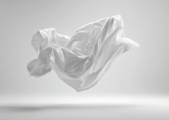 A flowing, white fabric dramatically sculpted in mid-air against a muted grey backdrop, showcasing its texture and weightlessness