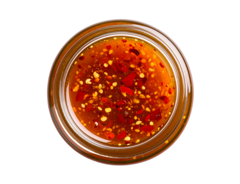 Glass jar filled with delicious, fermented hot honey, creating a sweet heat sauce enriched with probiotics, captured from above against a transparent background
