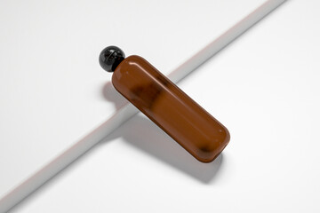 Cylindrical cosmetic bottle with ball shape flip cap, Brown amber glass plastic packaging with black Spherical flip Cap, round skincare container mockup, brown cylindrical shape squeeze bottle mockup