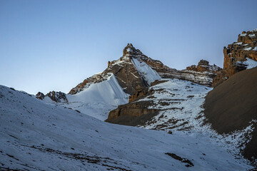 Syagang peak before sunrise in morning twilight, view from trekking route to Thorung La pass. Annapurna circuit trek, Nepal.