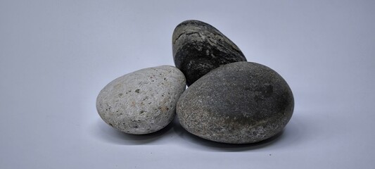 Separated sea pebbles on white background