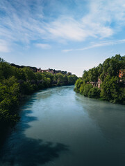 Clear Blue Water Of The Tiber River In Rome 