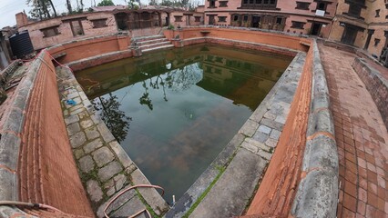 Tranquil Waters of the Heritage Pond at the National Art Gallery, Housed in Bhaktapur's Former Royal Palace, Nepal
