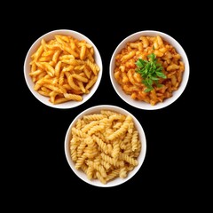 Delicious pasta dishes arranged in three bowls, featuring various shapes and sauces, creating inviting and appetizing presentation. Perfect for food lovers and culinary enthusiasts