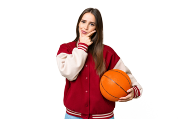 Young beautiful woman playing basketball over isolated chroma key background thinking