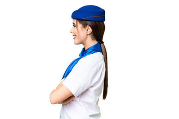 Airplane stewardess over isolated chroma key background in lateral position