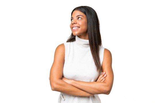 Young African american woman over isolated background looking up while smiling