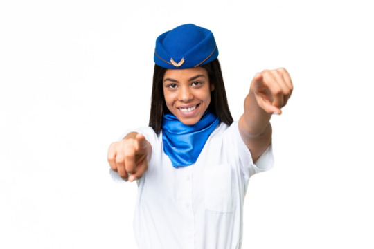 Airplane stewardess African american woman over isolated background points finger at you while smiling