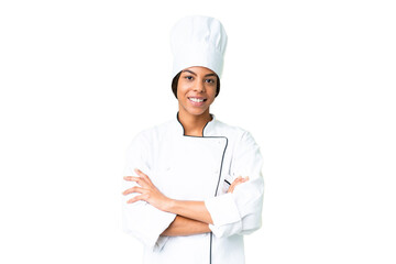 Young African American chef over isolated chroma key background keeping the arms crossed in frontal position
