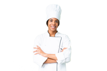Young African American chef over isolated chroma key background keeping the arms crossed in frontal position
